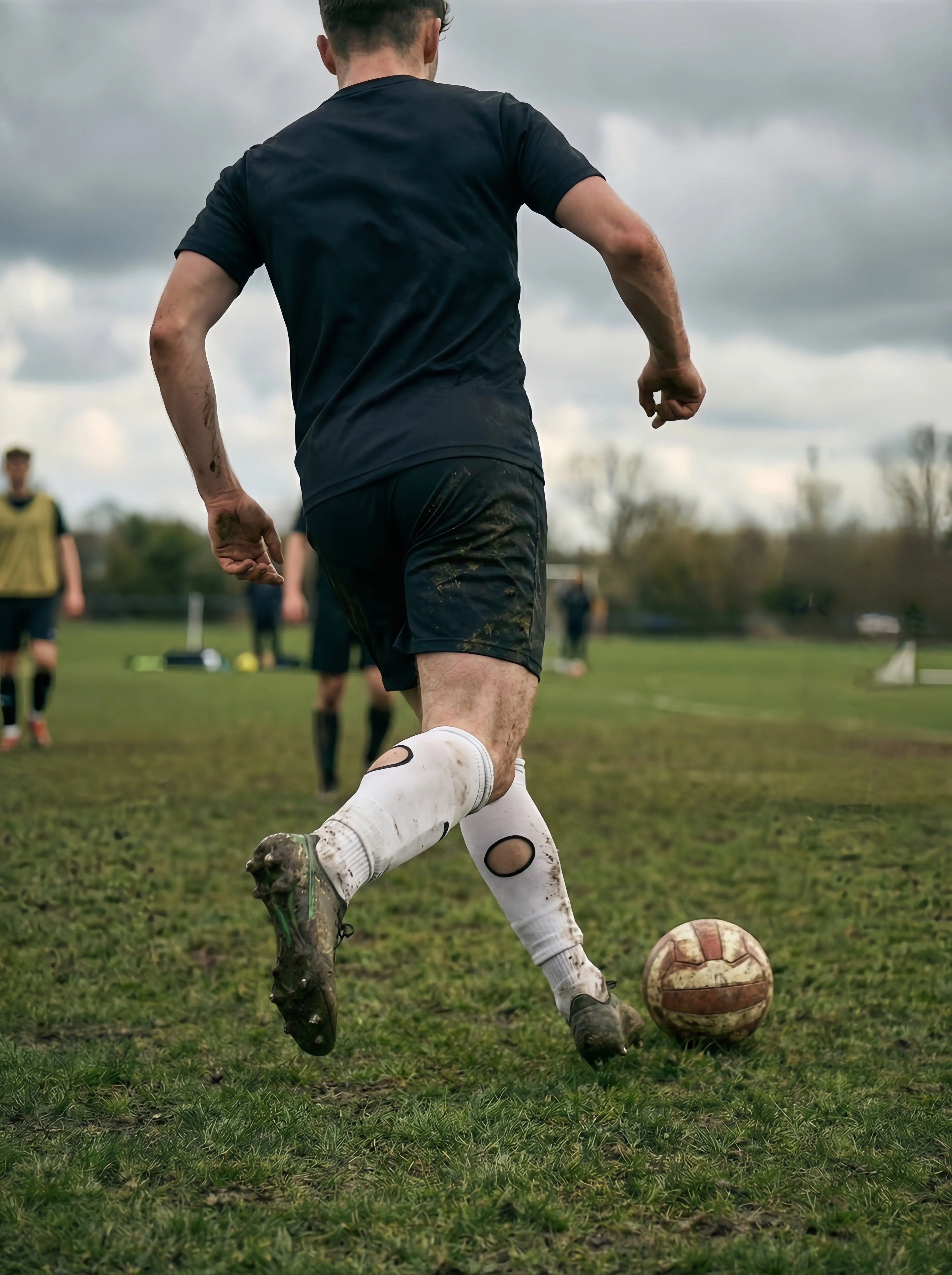 Football player wearing modern performance football socks for 2026 style and innovation